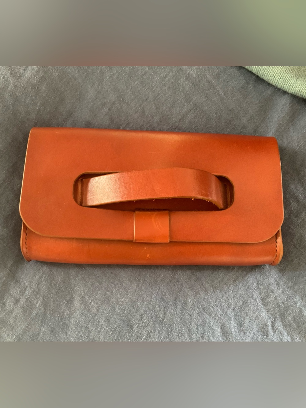 Handheld Leather Wristlet Clutch in Cognac